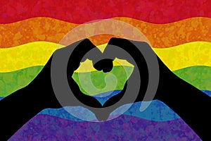 Two hands in the form of heart over LGBT colorful rainbow flag