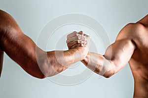 Two hands, helping arm of a friend, teamwork. Helping hand outstretched, isolated arm, salvation. Friendly handshake