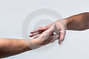 Two hands, helping arm of a friend, teamwork. Rescue, helping gesture or hands. Close up help hand. Helping hand concept