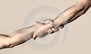 Two hands, helping arm of a friend, teamwork. Rescue, helping gesture or hands. Close up help hand. Helping hand concept