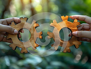 Two hands hold the gears together. puzzle pieces. Symbol of association and connection Teamwork