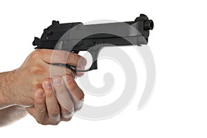 Two hands holding a gun with finger on the trigger
