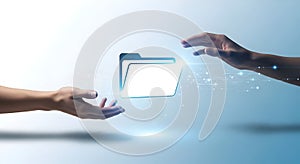 Two Hands Holding and Passing Glowing Digital Folder â Data Transfer and Sharing Concept