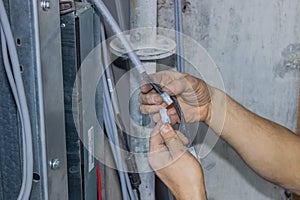 Two hands holding 4-Pin cable plug and socket