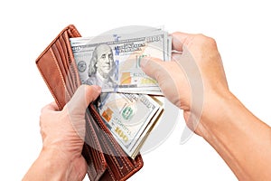 Two hands open the wallet to check the dollar amount to prepare for the next spending