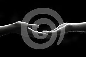 Two Hands Reaching, Support and Connection in Black and White
