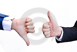 Two hands signalling thumbs up and thumbs down