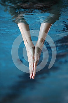 two hands together surfaced from water, V - shape