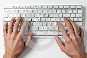 Hands typing on keyboard