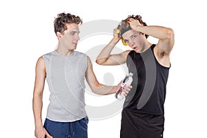 Two handsome guys doing fitness workout with weights isolated on white background