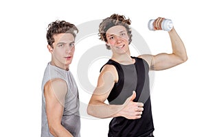 Two handsome guys doing fitness workout with weights isolated on white background