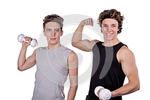 Two handsome guys doing fitness workout with weights isolated on white background