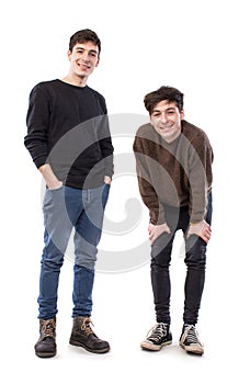 Two handsome young men posing on a white background