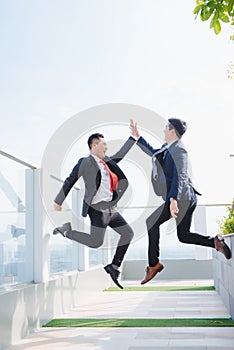 Two Happy Adult Business Men High Flying photo