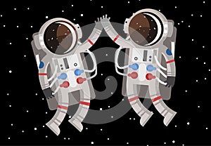 Two happy astronauts floating in space