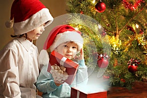 Two happy boys with christmas gift