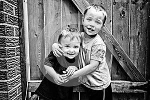 Two Happy Boys Hugging - Black and White