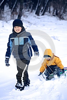 Two happy boys on sled