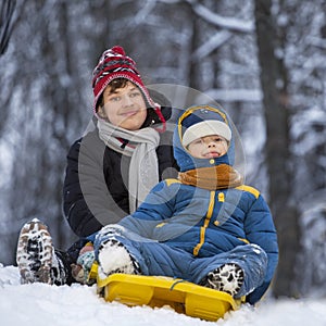 Two happy boys on sled