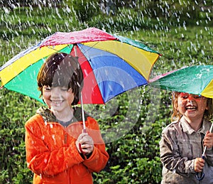 Two happy brother with umbrella