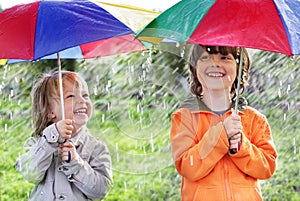 Two happy brother with umbrella