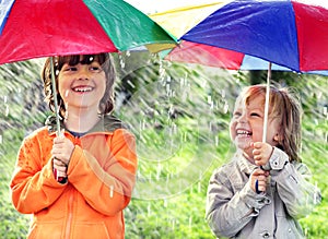 Two happy brother with umbrella