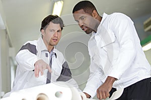 two happy builder workers facade painters