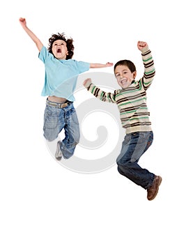 Two happy children jumping at once