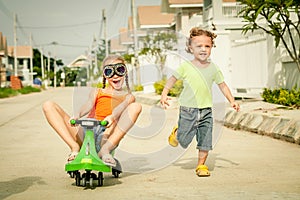 Two happy children playing on the road