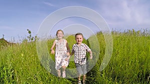 Two happy children playing on the road at the day time.