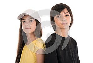 two children, boy and girl friends posing happily on white background