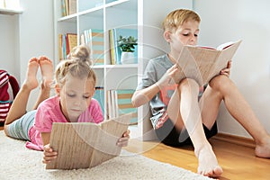 Two happy children studing at home because of corona virus quarantine