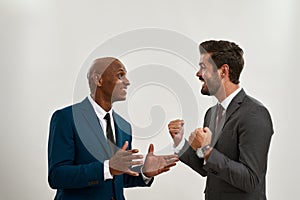 Two happy company employers talking in studio