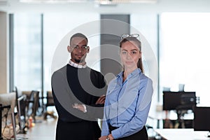 Two happy diverse professional executive business team people woman and African American man looking at camera standing