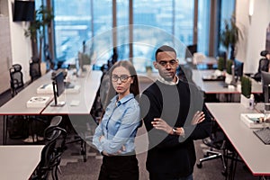 Two happy diverse professional executive business team people woman and African American man looking at camera standing