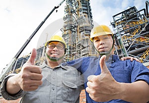 Two happy Factory workers with thumb up