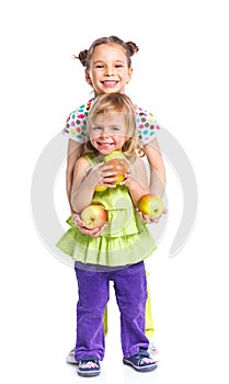 Two happy girls with apple