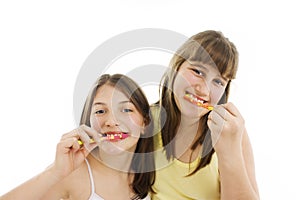 Two happy girls with toothbrush