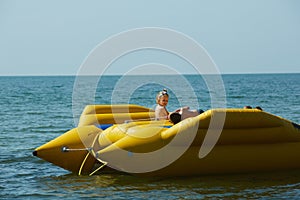 Two happy kids playing on the boat at summer day