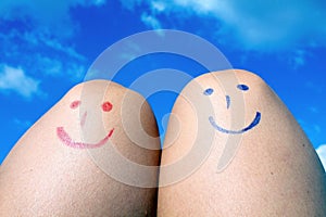Two happy knees in sunny summer day