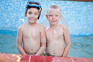 Two happy little friends in the pool