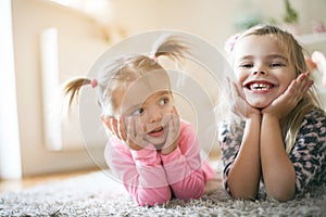 Two happy little girls. Looking at camera.