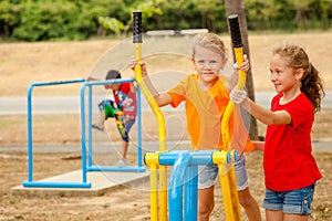 Two happy little girls on the playground