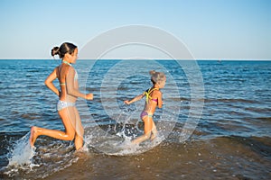 Two happy and positive girls sisters run