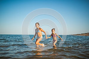 Two happy and positive girls sisters run