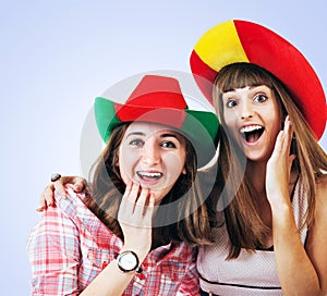 Two happy screaming girls - football fans