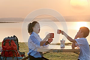 Two happy siblings drinking some milk