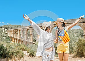 Two Happy young traveler woman