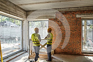 two hardworking bearded men in safety