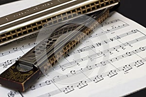 Two Harmonicas on sheet music
